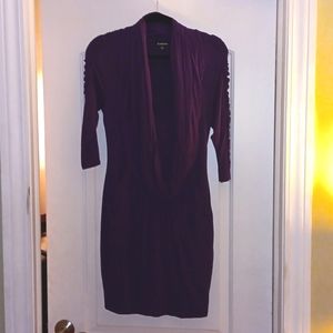 Purple dress with detailed shoulders a drop front and pockets